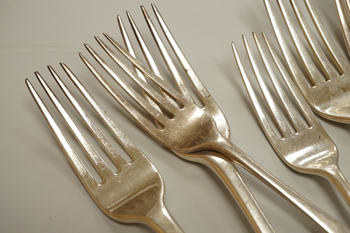 A set of eight George IV silver Hanoverian pattern table forks by Eley & Fearn, London, 1821, three other similar table forks and a set of eleven Victorian silver Hanoverian pattern dessert forks, George Adams, London, 1